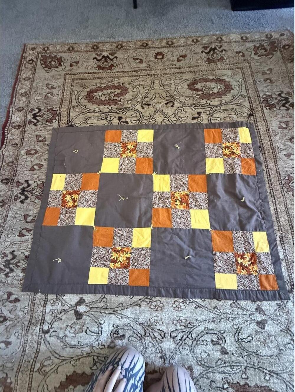 Handmade Patchwork quilt brown orange, yellow,  squares featuring floral prints.